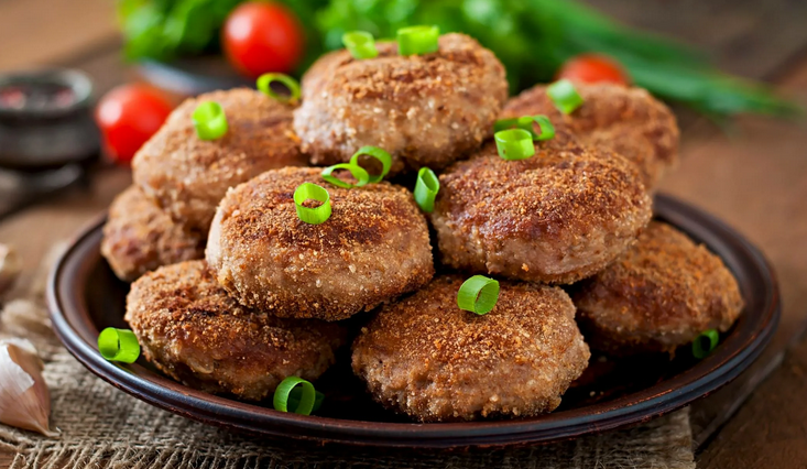 Juicy meat from minced meat from pork or beef, with the addition of potatoes in a pan