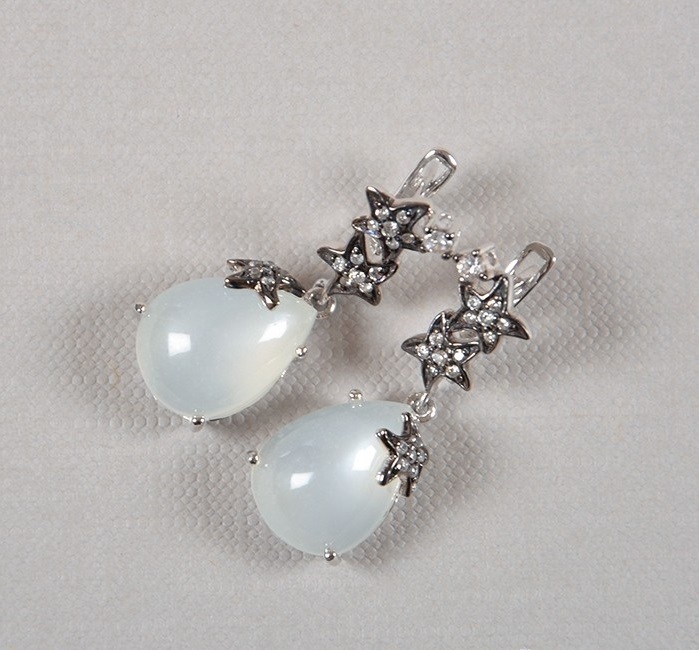 Catchy and elegant silver earrings with a lunar stone for spring-2023