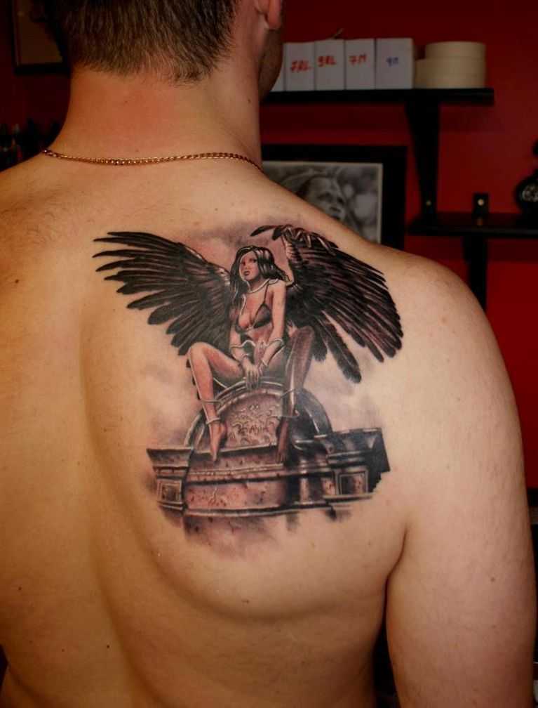 A woman with wings was applied as a tattoo as a charm