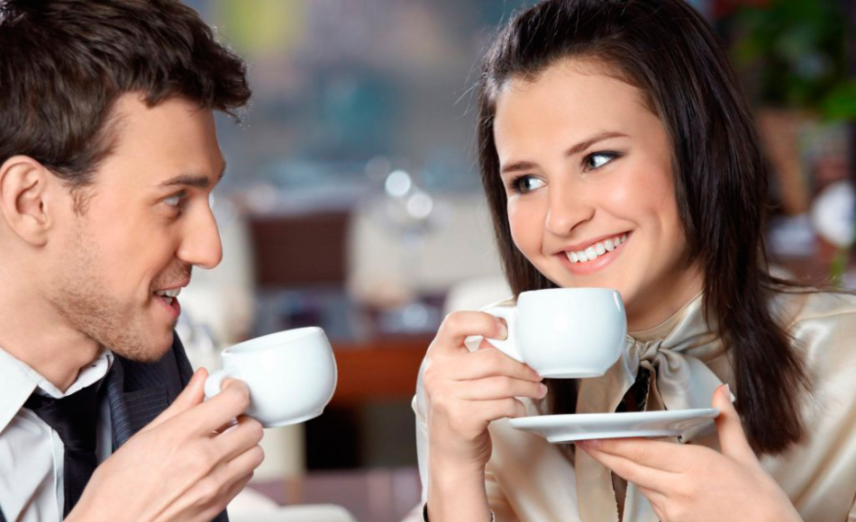 Girl and guy over a cup of coffee