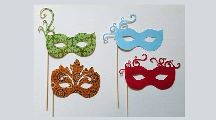 Masquerade mask on a stick for a carnival