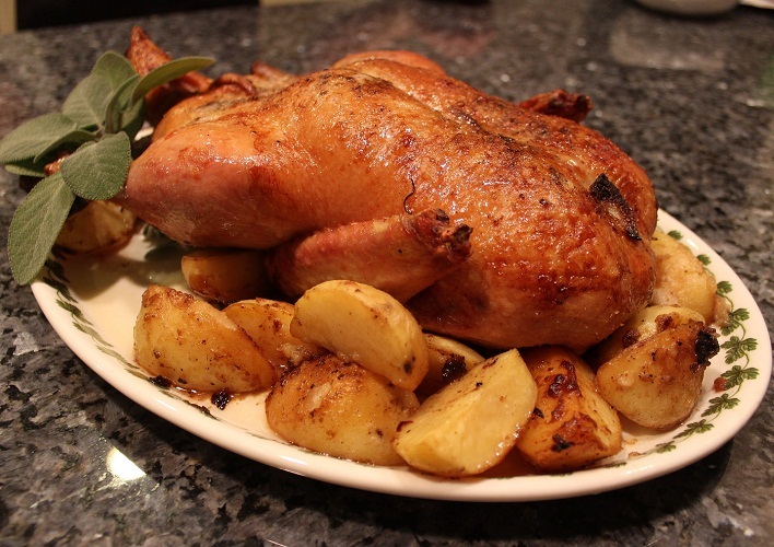 Baked duck with potatoes and bacon