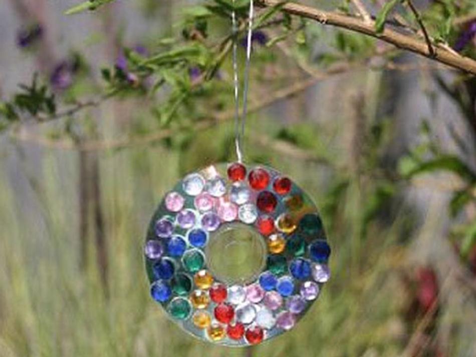 Bright ball on a Christmas tree from CD disc, example 3