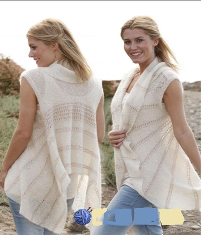 Real model of a light vest from a cashmere on a smiling blonde