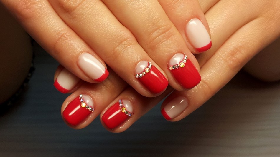 Red nail design with rhinestones