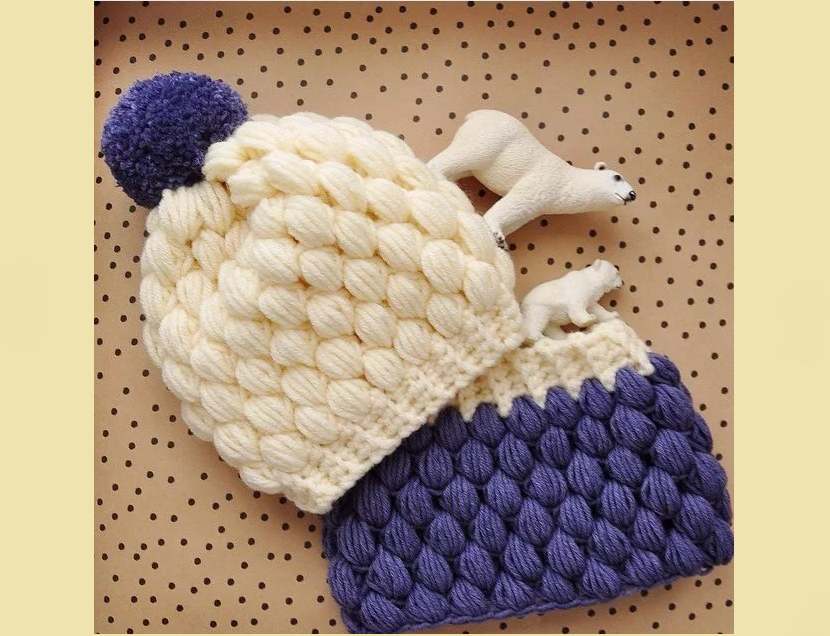 Knitted snood and a blue-white hat with a viscous popcorn crochet