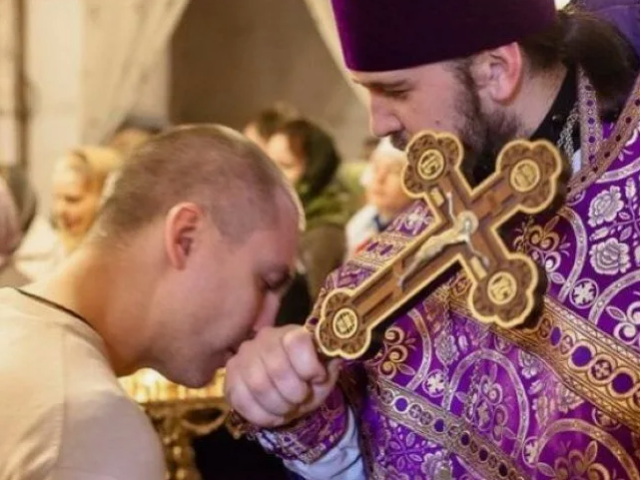 Why is the priest kissing a hand in the church: when is it necessary? Why didn't the priest let it kiss your hand?