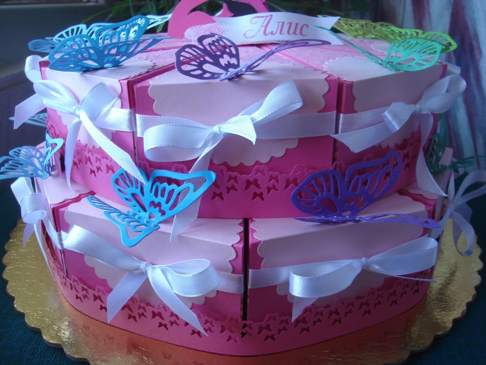 Cake made of colored paper with satin bows