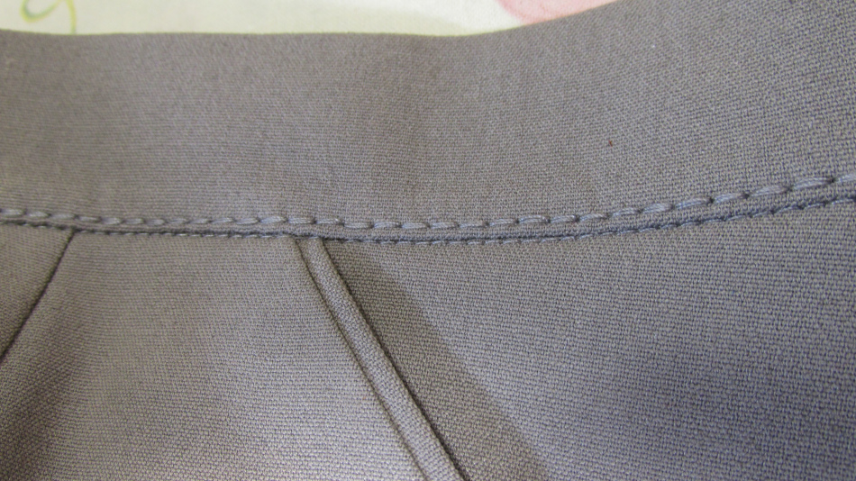 A sewn belt on women's trousers made with your own hands
