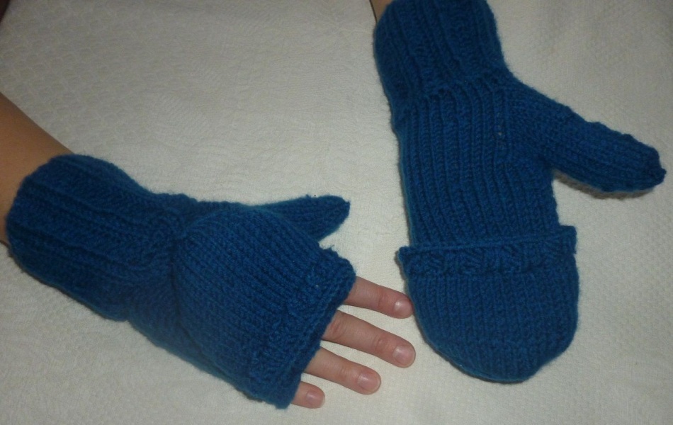 Dark blue unisex mittens-transformers with a folding top on the hand of the model