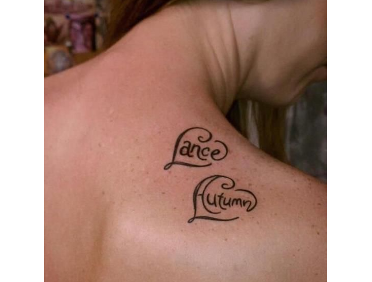 Tattoo on a shoulder blade for girls with inscriptions