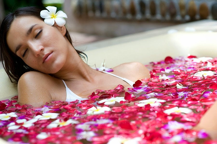 Girl in the bathroom with flower petals