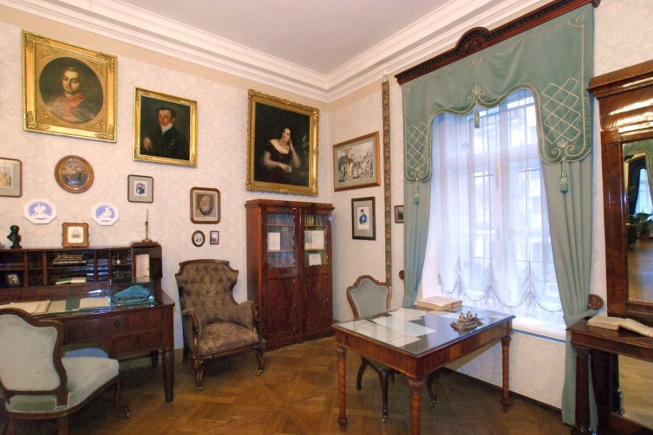 Manuscripts in cabinets, portraits on the walls - eyes scatter from the abundance of exhibits of an apartment -museum