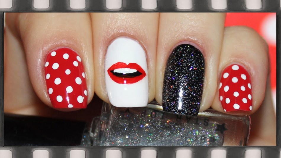 Red manicure in polka dots
