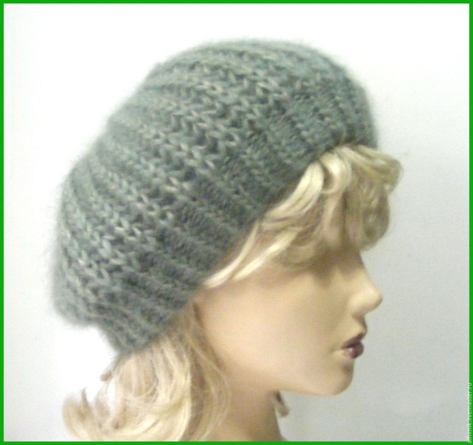Ready female beret from a mohair tied with knitting needles