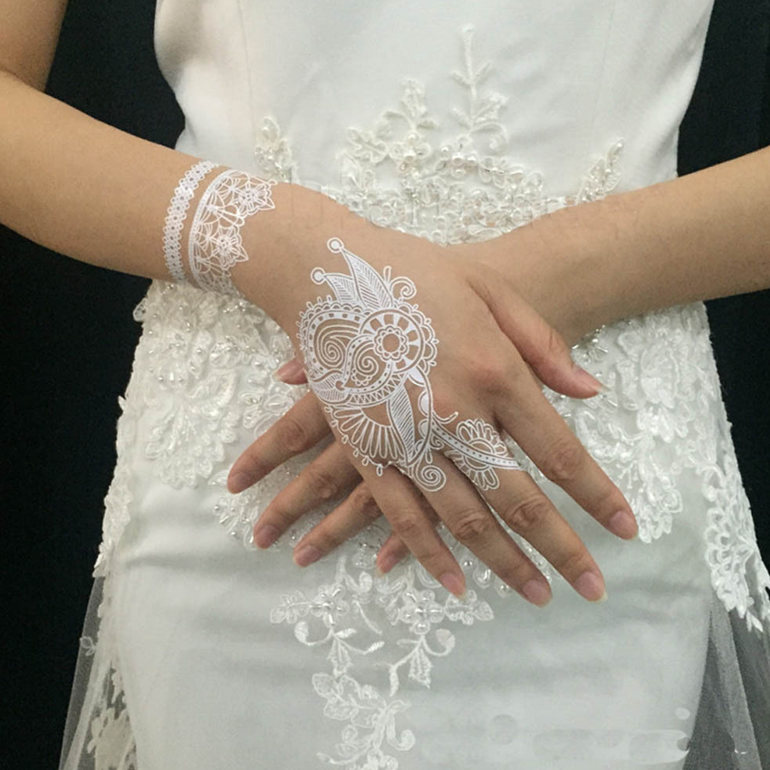 White mehendi on the arm