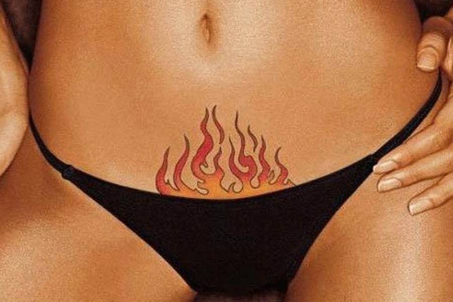 Татуировка огня на животе женская