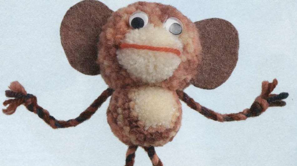 Monkey from pompons and felt
