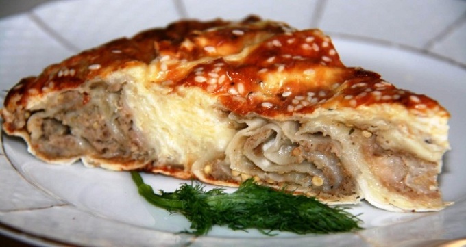 Lavash roll with minced meat baked in a cheese-mixed fill