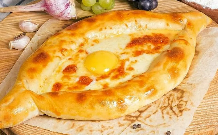 Khachapuri - cottage cheese dough with cheese and egg