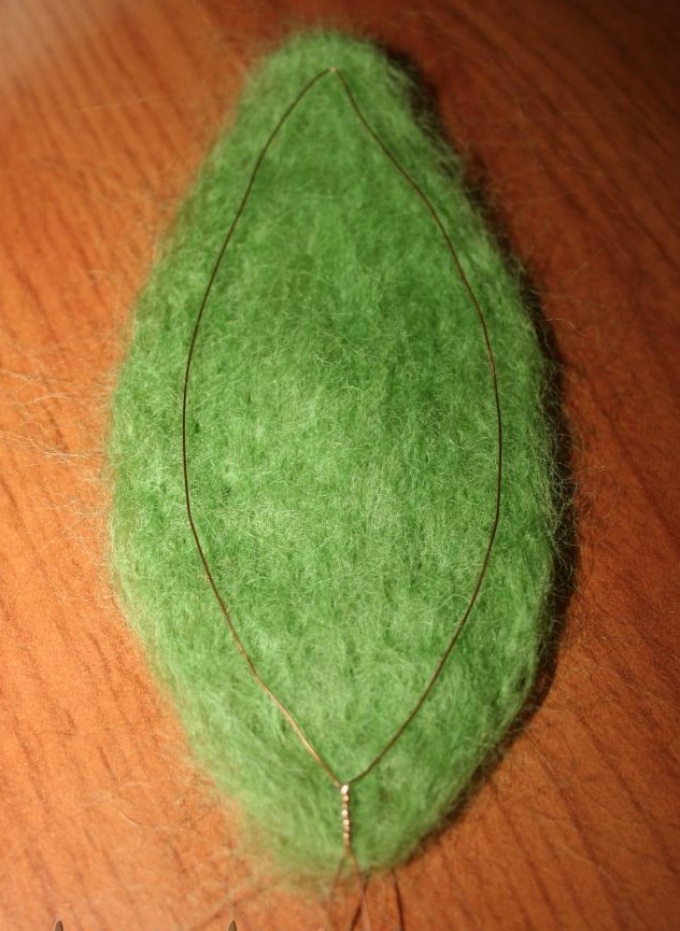 During felting, wire is again placed on the formed leaf blank