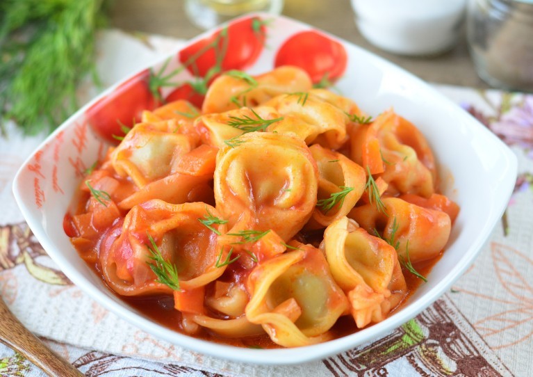 Frozen dumplings semi -finished products with vegetables fried in a pan