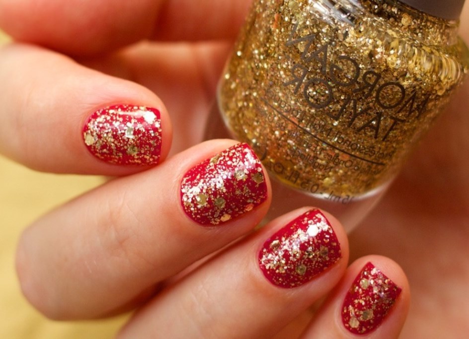Red manicure with sparkles