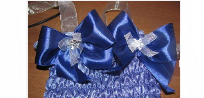 Sew the bows to the top from the costume 