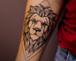 What does a tattoo mean, the mandala lion on the arm, brushes, finger, shoulder, neck, leg, thigh, back, stomach, lower back, forearm, face, chest, lion with crown, flower, in fire standing on the hind legs, for men and for men and for men and for men and women in the criminal environment? Tattoo, mandala lion: ideas, location, varieties, sketches, photos
