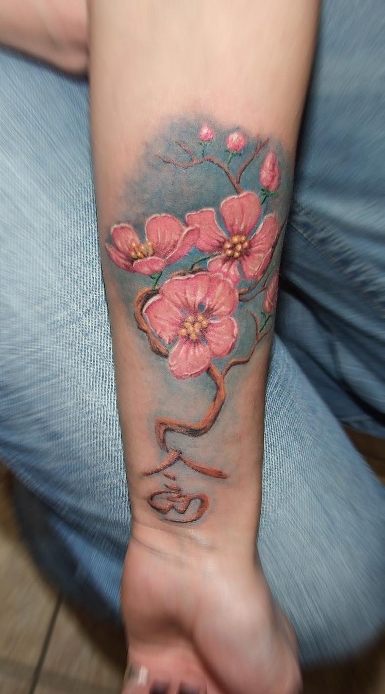 Sakura tattoo on the forearm