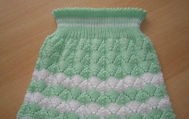 Children's openwork skirt with knitting needles with a pattern of Christmas tree