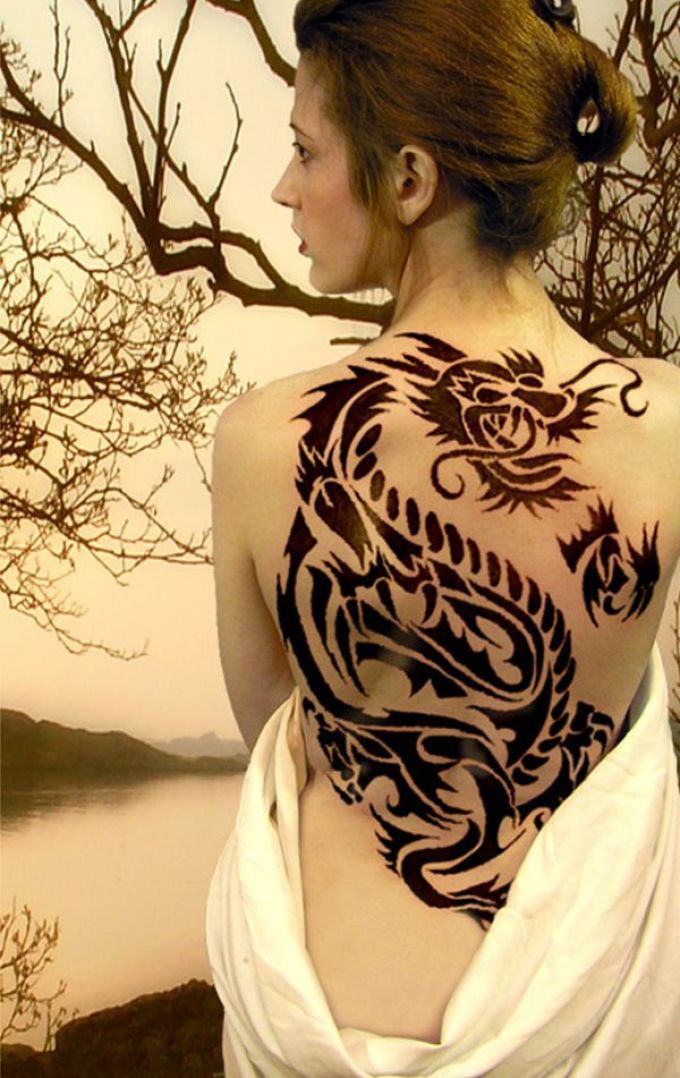 Girl's dragon on the back of a girl