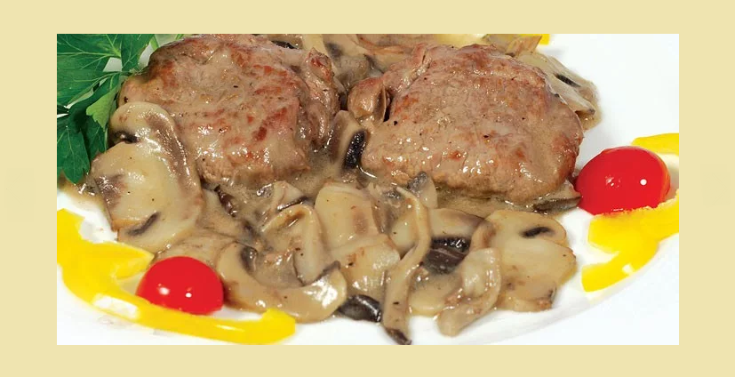 Delicious pork medallions in creamy sauce with mushrooms