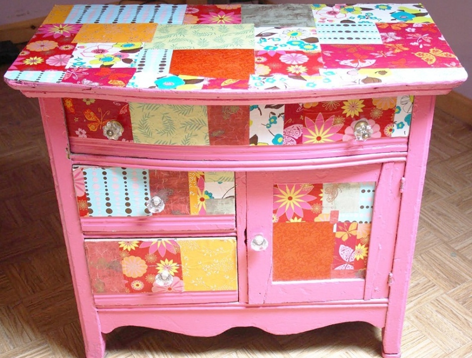 But the decoupage of one nightstand with completely different pieces of wallpaper