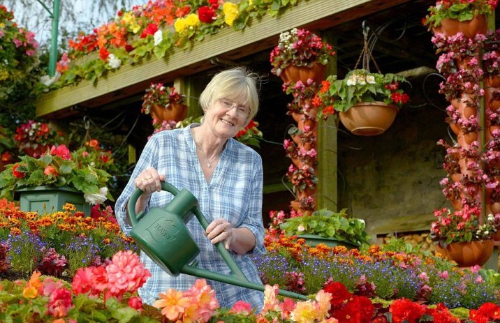 Woman after 50 years of landscaping an employee