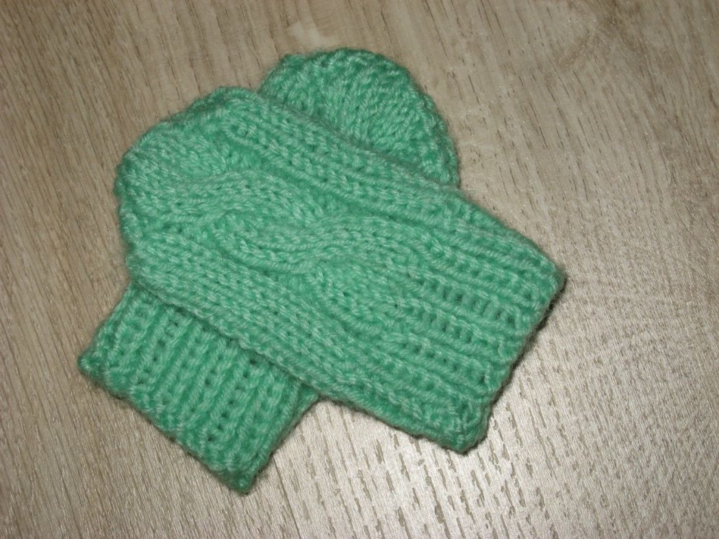 Knitted mittens scratches with a scythe for a newborn