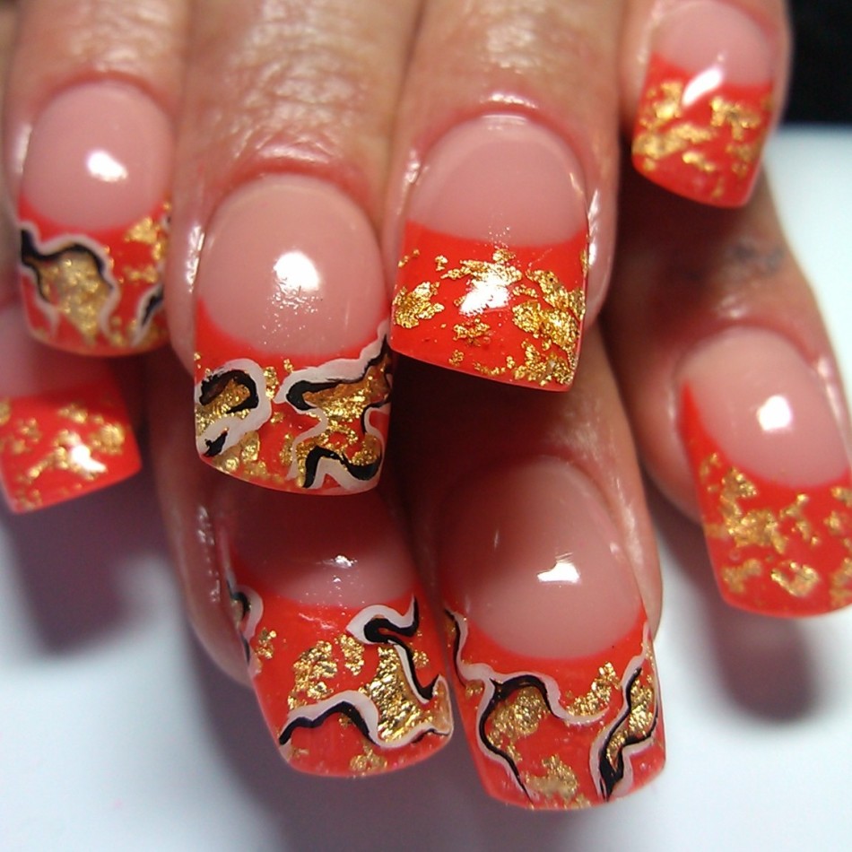 Red manicure with gold