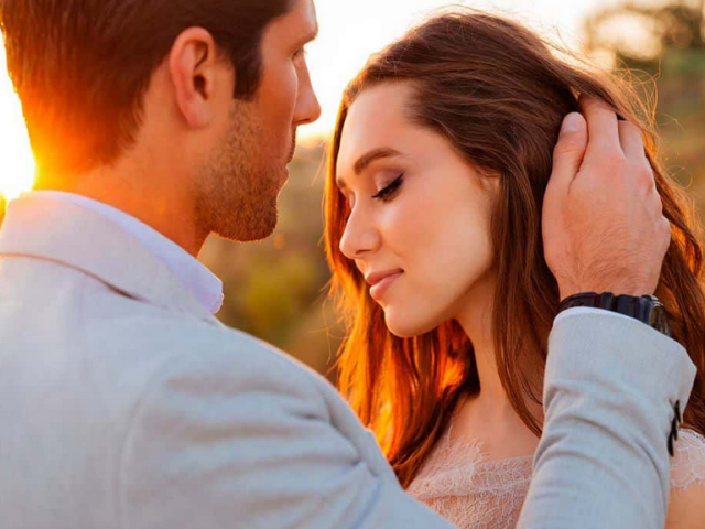 The guy touches the girl's face with his hands - strokes her cheek, chin: what does this mean in the language of gestures?