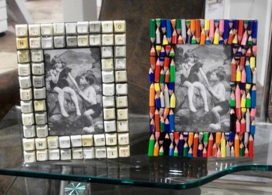 Photo frames decorated with unnecessary pencils and computer keys