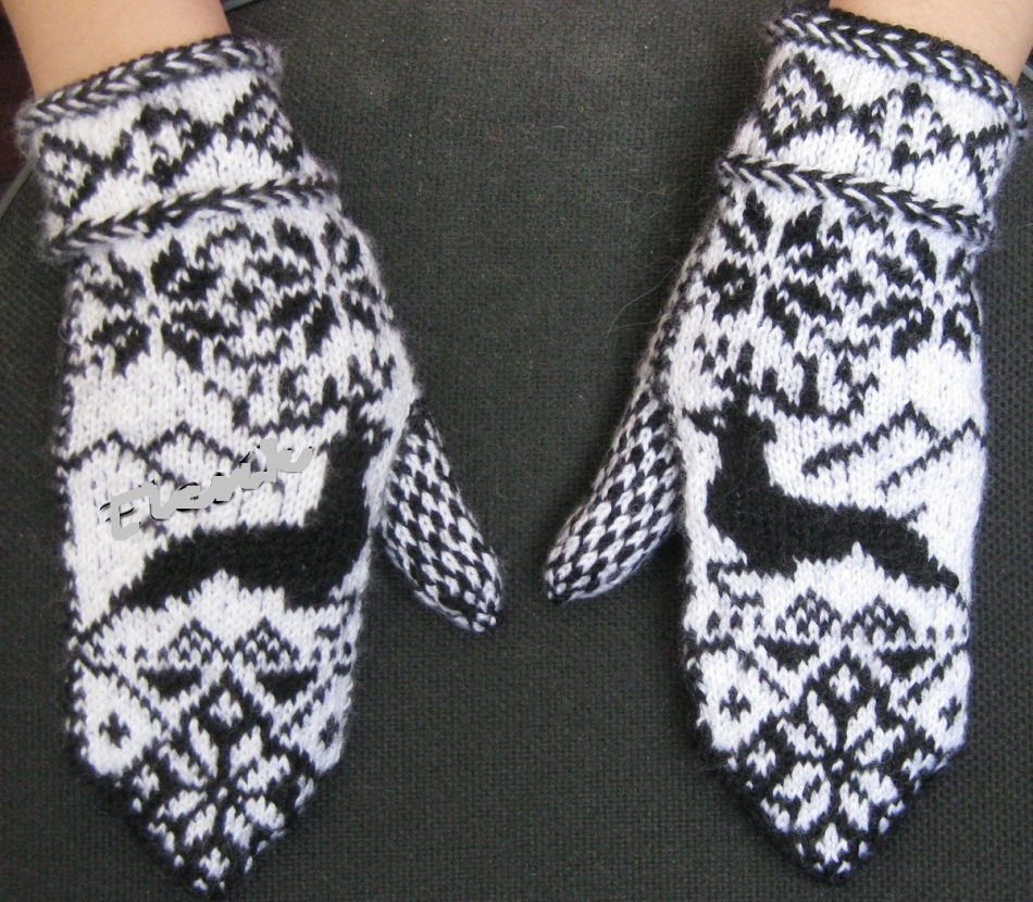 Black and white knitted knitting mittens with deer