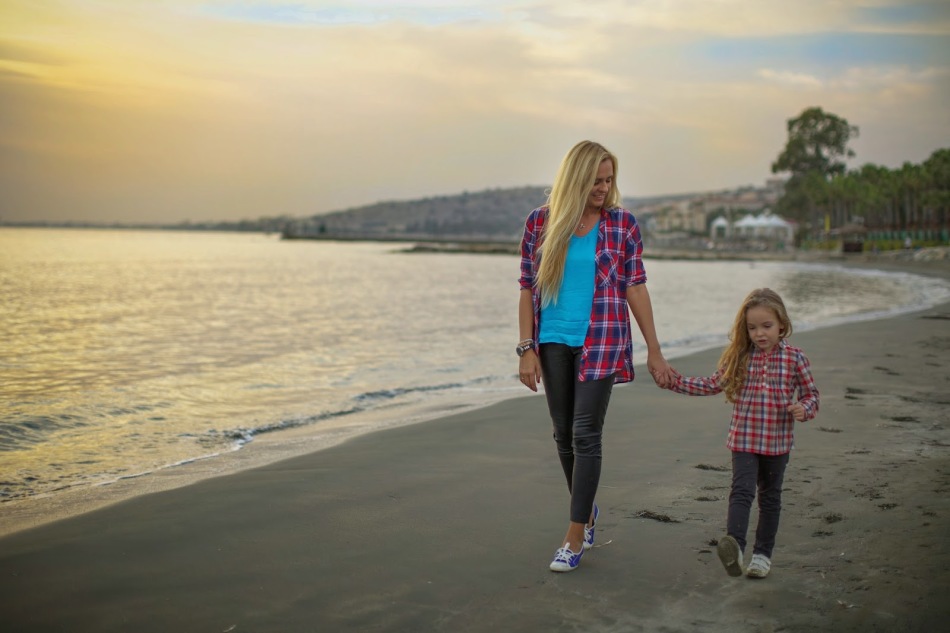 Mom and daughter's walk by the hand