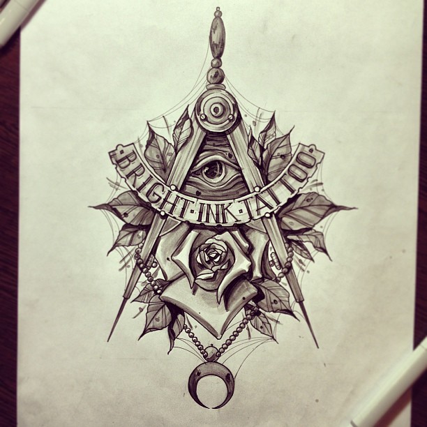 Drawing tattoo on hand with mysterious symbols of Masons