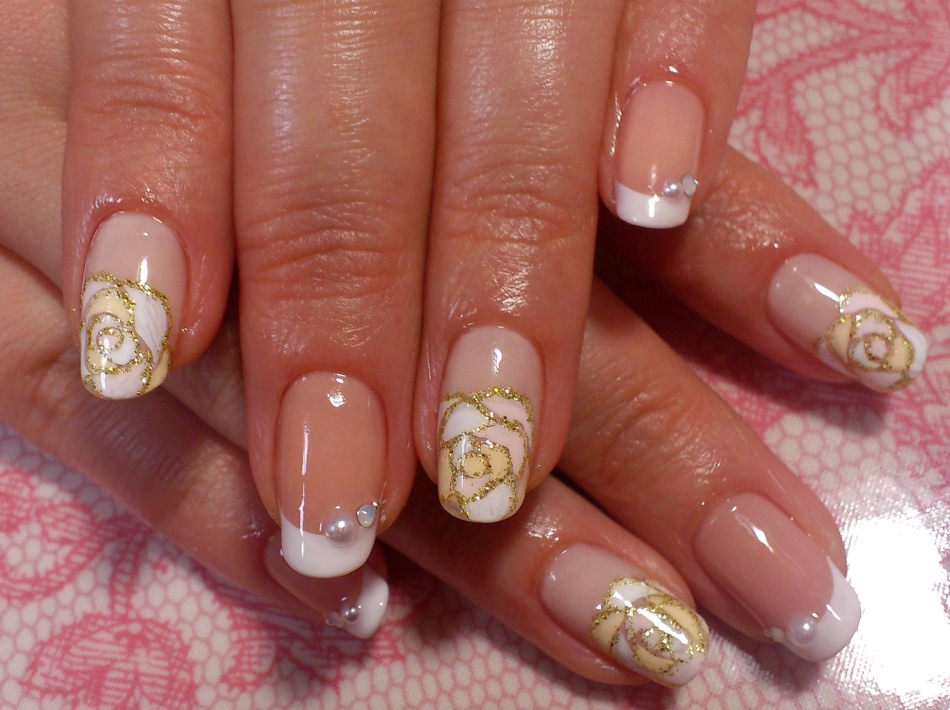 Festive manicure with gold roses