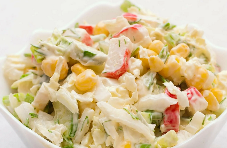 Unusual crab salad with cabbage, apple and pepper