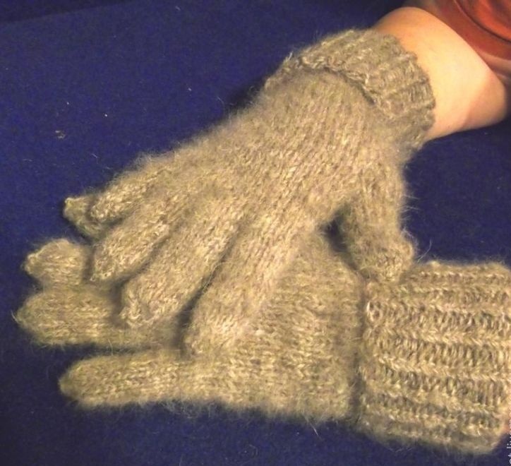 Winter gloves with knitting needles on the arms of a child