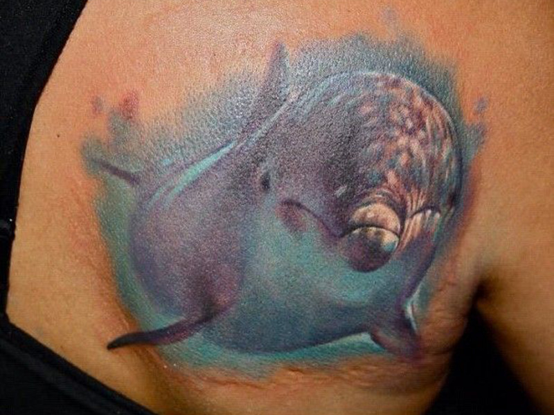 Dolphin Tatto as a symbol of the desire for freedom
