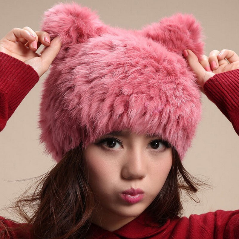 Knitted hat made of natural fur with ears.