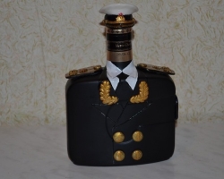 How beautiful it is to decorate a bottle of cognac with your own hands as a gift for a man in military uniforms, a policeman, hussar, a tuxedo, photography, ribbons, sweets, a bouquet of sweets: ideas, design, photo. How to decorate a bottle of cognac with your own hands for a woman?
