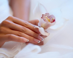 Fashionable wedding manicure: white nail design. Wedding nails - bride manicure