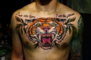 Apa arti tato harimau untuk anak perempuan, pria dan wanita? TAGER TAGING: Lokasi, varietas, sketsa, foto. Tato apa yang dikombinasikan dengan tato harimau?